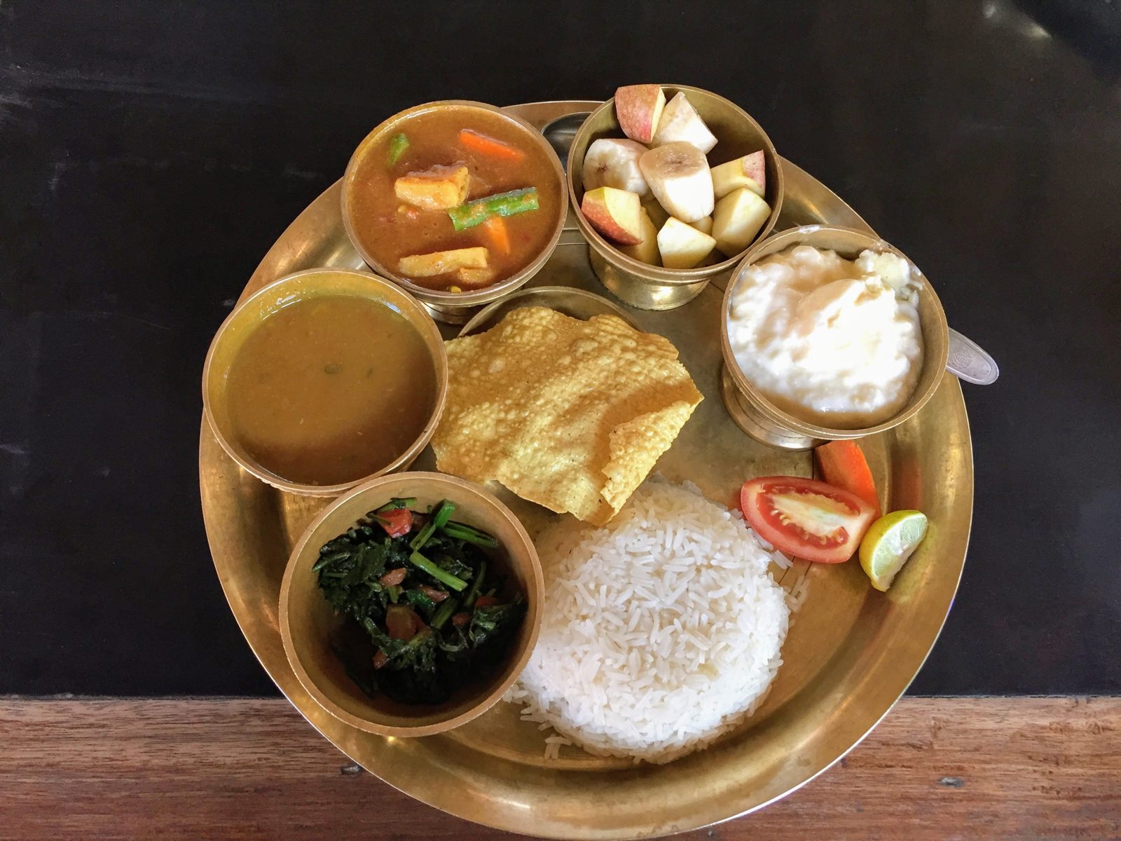 Dal bhat tarkari khana set on a steel plate